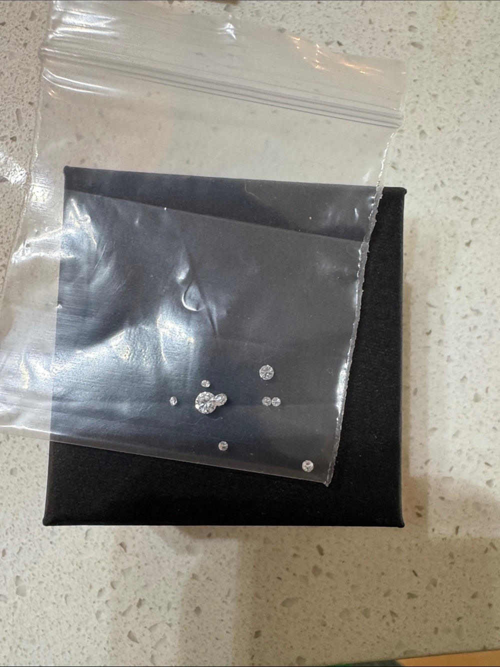 9-Multiple size clear round stones